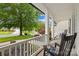 Cozy front porch with rocking chairs and a view of the manicured lawn at 136 Pink Orchard Dr, Mooresville, NC 28115