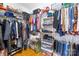 Spacious walk-in closet with shelving and ample storage for clothing and accessories at 136 Pink Orchard Dr, Mooresville, NC 28115