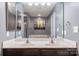 Bathroom with a double sink vanity, large mirror, and modern fixtures providing a spacious and functional design at 1398 Kent Downs Sw Ave # 52, Concord, NC 28027