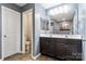 Bathroom features a double sink vanity, a toilet and a door accessing the shower stall, creating a functional design at 1398 Kent Downs Sw Ave # 52, Concord, NC 28027