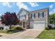 Charming two-story home with a well-manicured lawn, two car garage, and a welcoming front porch at 1398 Kent Downs Sw Ave # 52, Concord, NC 28027