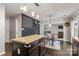 Open-concept kitchen with an island, breakfast nook, and seamless transition to the living area at 1398 Kent Downs Sw Ave # 52, Concord, NC 28027