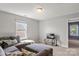 Cozy living room with a large sectional sofa, carpet floors and a view of an adjacent room from the window at 1398 Kent Downs Sw Ave # 52, Concord, NC 28027