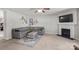 Cozy living room with a fireplace, comfortable seating, and a wall-mounted television at 1398 Kent Downs Sw Ave # 52, Concord, NC 28027