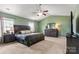Serene primary bedroom with vaulted ceilings, ample space, and coordinated furnishings at 1398 Kent Downs Sw Ave # 52, Concord, NC 28027