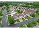 Aerial view of a neighborhood with well-maintained lawns and mature trees on a sunny day at 1418 Skidaway Nw St # 427, Concord, NC 28027