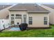 The backyard has a patio with seating and a grill; great space for entertaining at 1418 Skidaway Nw St # 427, Concord, NC 28027