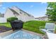 View of a patio with a grill in a backyard space; great for entertaining at 1418 Skidaway Nw St # 427, Concord, NC 28027