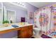 Unique bathroom featuring purple walls, decorative art, and vanity at 1418 Skidaway Nw St # 427, Concord, NC 28027