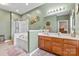 Bathroom with a shower, soaking tub, double vanity, and decorative art at 1418 Skidaway Nw St # 427, Concord, NC 28027