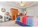 Spacious bedroom with a large armoire, dresser, and bed featuring colorful linens at 1418 Skidaway Nw St # 427, Concord, NC 28027