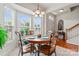 Cozy breakfast nook with bay window, hardwood floors, and a chandelier at 1418 Skidaway Nw St # 427, Concord, NC 28027