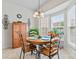 Cozy dining area featuring a round table, stylish chairs, and large windows for natural light at 1418 Skidaway Nw St # 427, Concord, NC 28027