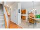Bright dining area with a round wooden table, tile flooring, and nearby kitchen access at 1418 Skidaway Nw St # 427, Concord, NC 28027
