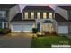 Charming two-story home featuring a two-car garage, well-manicured lawn, and beautiful landscaping at 1418 Skidaway Nw St # 427, Concord, NC 28027