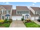 Aerial view of an attractive two-story home featuring a two-car garage and manicured lawns at 1418 Skidaway Nw St # 427, Concord, NC 28027