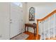 Welcoming foyer with hardwood floors, staircase, and decorative accents at 1418 Skidaway Nw St # 427, Concord, NC 28027