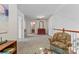 Upstairs hallway featuring neutral carpet and access to the upstairs rooms at 1418 Skidaway Nw St # 427, Concord, NC 28027