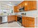 Kitchen featuring stainless steel appliances, wooden cabinets, and views to breakfast nook at 1418 Skidaway Nw St # 427, Concord, NC 28027