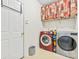 Functional laundry room with a modern washer and dryer, storage shelf, and ample space at 1418 Skidaway Nw St # 427, Concord, NC 28027