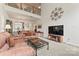 Open-concept living room with neutral carpet, featuring a view to the second floor landing at 1418 Skidaway Nw St # 427, Concord, NC 28027