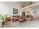 Bright living room showcasing plush couches, artwork, and neutral carpeting in an open layout at 1418 Skidaway Nw St # 427, Concord, NC 28027