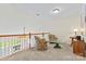 Cozy loft area showcasing a comfortable seating arrangement and second-floor balcony views at 1418 Skidaway Nw St # 427, Concord, NC 28027