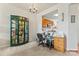 Home office with a view to the kitchen and an elaborate display case at 1418 Skidaway Nw St # 427, Concord, NC 28027