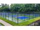 Community pickleball courts surrounded by lush landscaping and fencing at 1418 Skidaway Nw St # 427, Concord, NC 28027
