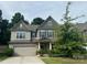 Charming two-story home with a two-car garage and well-maintained landscaping at 145 W Morehouse Ave, Mooresville, NC 28117