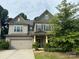 Charming two-story home with a two-car garage and well-maintained landscaping at 145 W Morehouse Ave, Mooresville, NC 28117