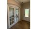 Bright foyer with double doors and hardwood flooring, leading to other rooms at 145 W Morehouse Ave, Mooresville, NC 28117