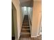 Carpeted stairs with wooden handrail at 145 W Morehouse Ave, Mooresville, NC 28117