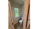 Toilet room features a window with wooded views at 145 W Morehouse Ave, Mooresville, NC 28117