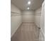 Spacious walk-in closet featuring neutral carpeting and wire shelving for efficient storage at 145 W Morehouse Ave, Mooresville, NC 28117