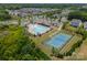 Aerial view of the neighborhood pool, tennis courts, and surrounding residential area at 14505 Rhodes Hall Dr, Charlotte, NC 28273
