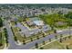 Aerial shot of community pool and recreation area, featuring a pool, tennis court, and parking at 14505 Rhodes Hall Dr, Charlotte, NC 28273