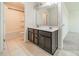 Bright bathroom features double sink vanity with tile flooring and a tub and shower combination at 14505 Rhodes Hall Dr, Charlotte, NC 28273