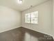Bright bedroom with hardwood floors, large window, and ample natural light at 14505 Rhodes Hall Dr, Charlotte, NC 28273