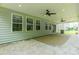 Large covered patio featuring ceiling fans, access to the backyard and great natural lighting at 14505 Rhodes Hall Dr, Charlotte, NC 28273