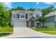 Charming two-story home featuring a stone entrance, a two-car garage and verdant landscaping at 14505 Rhodes Hall Dr, Charlotte, NC 28273