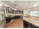 Stylish kitchen featuring stainless steel appliances, granite countertops, and ample cabinet space, adjacent to breakfast area at 14505 Rhodes Hall Dr, Charlotte, NC 28273