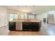 Kitchen with granite countertops, stainless steel dishwasher, and bar seating overlooking the living areas at 14505 Rhodes Hall Dr, Charlotte, NC 28273