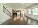 Open concept living room featuring hardwood floors and views of the kitchen at 14505 Rhodes Hall Dr, Charlotte, NC 28273