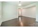 Bright living room featuring hardwood floors and front entry view at 14505 Rhodes Hall Dr, Charlotte, NC 28273