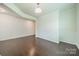 Bright living room featuring hardwood floors and wainscoting at 14505 Rhodes Hall Dr, Charlotte, NC 28273