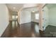 Bright living room with hardwood floors, wainscoting, and neutral paint at 14505 Rhodes Hall Dr, Charlotte, NC 28273