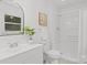 Bright bathroom with a modern vanity, a walk-in shower, and ample natural light at 146 Duff St, Gastonia, NC 29715