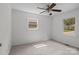 A well-lit bedroom with neutral colors and a ceiling fan at 146 Duff St, Gastonia, NC 29715