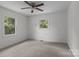 A bright, neutral-toned bedroom with a ceiling fan and windows for natural light at 146 Duff St, Gastonia, NC 29715